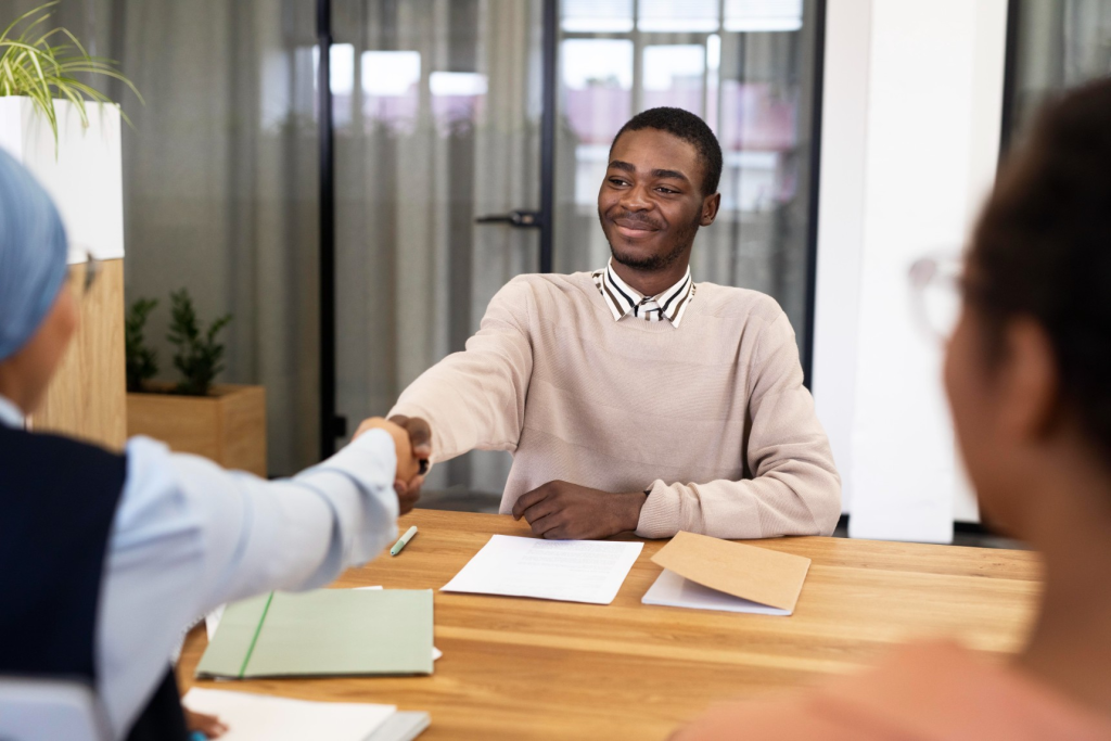 man handshaking his employer after being accepted his new office job 1.webp