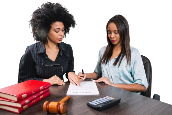 african american woman pointing document near lady with pen table